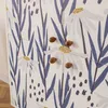 A close-up view of a cabinet with a floral pattern and wooden knobs. Náhled obrázku produktu