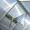 View of the interior of a greenhouse roof with an automatic vent open. Produktbild-Vorschau