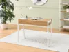 A modern desk with a white frame and a wooden top, placed on a rug in a room with light green walls. Voir les images du produit