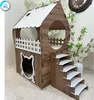 A wooden cat house with stairs and a cat-shaped entrance, decorated with white accents. Produktbild-Vorschau