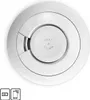 A top-down view of a white smoke detector with 'TEST & STUMM' text in the center. Produktbild-Vorschau