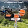 An ATV and a winch are shown in a mountainous, grassy environment, with text highlighting the winch's features. Podgląd zdjęcia produktu
