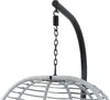 A close-up view of the hanging mechanism of a chair, showing a spring and chain attached to a curved stand. Produktbild-Vorschau