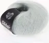 A ball of light blue yarn with a black label wrapped around it. Produktbild-Vorschau