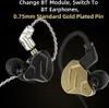 Two in-ear headphones, one black and one gold, are shown against a black background. One of the black headphones has a detachable transparent module with gold pins, which is shown being connected to the headphone. Text is overlaid on the top of the image. Podgląd zdjęcia produktu