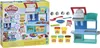 A collage of a Play-Doh Kitchen Creations set, showing the product packaging and the toy itself with accessories and Play-Doh containers. Náhľad obrázku produktu