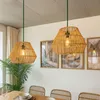 A dining room with pendant lights and artwork on the wall. Produktbild-Vorschau