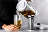 A person is pouring tea from a ZWILLING Enfinigy electric kettle into a glass. Náhled obrázku produktu