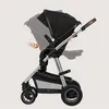 A side view of a black and silver stroller with brown accents, shown with arrows indicating movement or adjustment. Produktbild-Vorschau