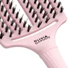 A close-up shot of a pink hairbrush. Produktbild-Vorschau
