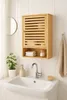 A bathroom sink with a wall-mounted bamboo cabinet above it. Produktbild-Vorschau