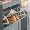 A close-up of a gray shoe cabinet with two compartments open, revealing pairs of shoes inside. Produktbild-Vorschau