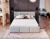 A bedroom scene with a bed as the main focus, a rug on the floor, and some decorative elements in the background. Produktbild-Vorschau