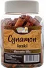 A clear, well-lit product shot of a jar filled with cinnamon sticks, with a label detailing product information. Podgląd zdjęcia produktu