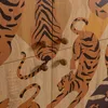 A close-up view of cabinet doors with a tiger pattern and wooden knobs. Produktbild-Vorschau