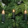 Close-up of three Christmas lights on a green artificial Christmas tree. Produktbild-Vorschau