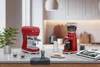 A kitchen counter setting with coffee-making equipment and accessories. Náhled obrázku produktu
