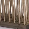 A close-up view of a room divider made of natural wood branches. Náhľad obrázku produktu