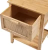 A close-up view of an open drawer on a wooden nightstand. Produktbild-Vorschau