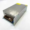 A silver industrial power supply unit with a terminal block on a white background. Podgląd zdjęcia produktu