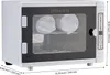 A sterilizer machine with a glass door, showing rolled towels inside. Náhľad obrázku produktu