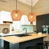 A modern kitchen island with pendant lights and appliances. Produktbild-Vorschau