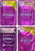 A collage of four Whiskas cat food pouches, each showing the brand logo and flavor information. Produktbild-Vorschau