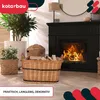A cozy living room scene with a fireplace, firewood basket, and plants. Voir les images du produit