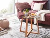 A living room scene with a coffee table and sofa. Anteprima dell’immagine prodotto
