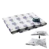 A folded vacuum storage bag with a lavender pattern and a valve, shown with smaller inset images demonstrating its use. Náhľad obrázku produktu