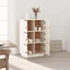 A white wooden cabinet filled with kitchenware and decorative items, placed in a well-lit room with a window and a dining table visible. Voir les images du produit