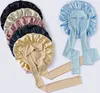 A collection of satin bonnets with ties, displayed on a white background. Voir les images du produit