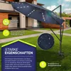 A navy blue cantilever umbrella with LED lights is set up on a green lawn in front of a house. Voir les images du produit