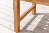 Close-up of a wooden chair leg on a light-colored wooden deck. Produktbild-Vorschau