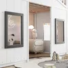 Interior view of a child's playhouse-style bed frame with windows and a bedside table. Produktbild-Vorschau