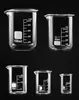Five glass beakers of varying sizes are arranged in two rows against a black background. Anteprima dell’immagine prodotto