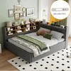 A bedroom scene featuring a bed with a headboard bookshelf and decorative items. Produktbild-Vorschau