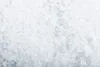 A close-up, overhead view of a pile of white, crystalline cat litter. Náhľad obrázku produktu