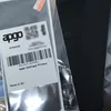 The image shows the packaging of a hydrogel privacy screen protector. The packaging is partially open, revealing the product inside. A black object, possibly a phone or a case, is visible to the right. Produktbild-Vorschau