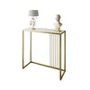 A console table with a marble top and gold metal frame, decorated with a lamp and a bust. Náhľad obrázku produktu