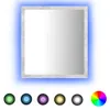 A square mirror with a concrete-effect frame and blue LED lighting, shown with a selection of color swatches below. Produktbild-Vorschau