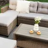 An outdoor lounge set with a coffee table on a patio. Náhľad obrázku produktu
