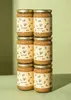 Six jars of tahini stacked in two columns against a light green background. Produktbild-Vorschau