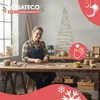 A woman is crafting a wooden Christmas tree decoration in a workshop. Podgląd zdjęcia produktu