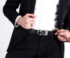 A man in a suit holding a cigar and adjusting his belt. Anteprima dell’immagine prodotto