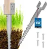 A ground screw post anchor is shown partially installed in soil and grass, with a separate anchor and screws displayed. Produktbild-Vorschau