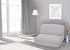 A modern living room scene with a floor lamp, a chair, and a framed picture on the wall. Podgląd zdjęcia produktu