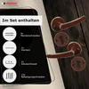 A set of door handles and accessories is displayed on a dark wooden background, with a black overlay showing included items. Produktbild-Vorschau