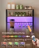 A kitchen shelf unit with LED lighting and various kitchen items. Produktbild-Vorschau