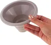 A hand holding a gray funnel. Voir les images du produit